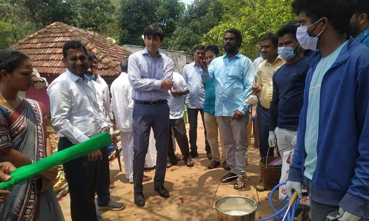 District Collector Sumit Kumar examining the method of spraying in Alluri Sitarama Raju district on Friday