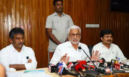 YSRCP Rajya Sabha MP V Vijayasai Reddy addressing the media at S V University in Tirupati on Friday. Tirupati MP M Gurumoorthy is also seen.