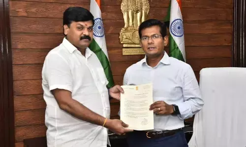 YSRCP leader Peddireddy Suryaprakash Reddy submitting a representation to Prakasam District Collector  A S Dinesh Kumar in Ongole  on Saturday