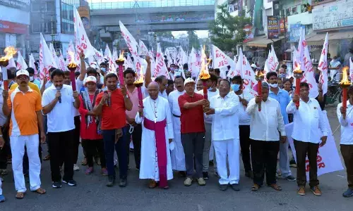 Bishop Thelagathoti Joseph Raja Rao, Director of the social service centre, Fr Muvvala Prasad and others taking part in  ‘Run for Jesus’ programme in Vijayawada on Saturday 	Photo: Ch V Mastan