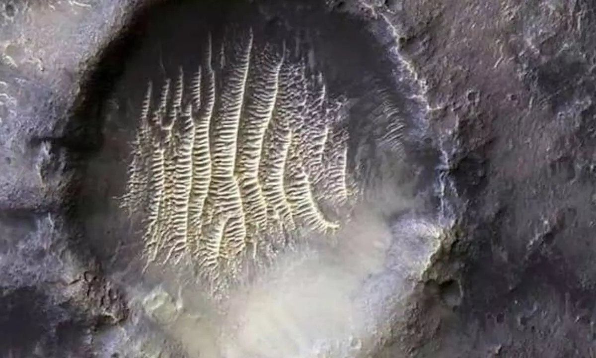 Crater on Mars looks like an alien footprint!