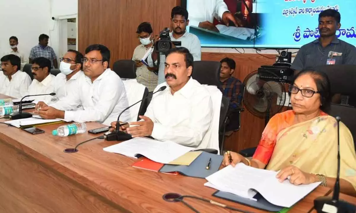 Agriculture Minister K Govardhan Reddy addressing the officials at a review meet in Nellore on Monday