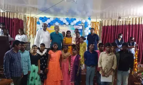 Chennai-based ‘Help the Blind’ Foundation distributing scholarships to visually impaired students at Andhra Loyola College in Vijayawada on Monday