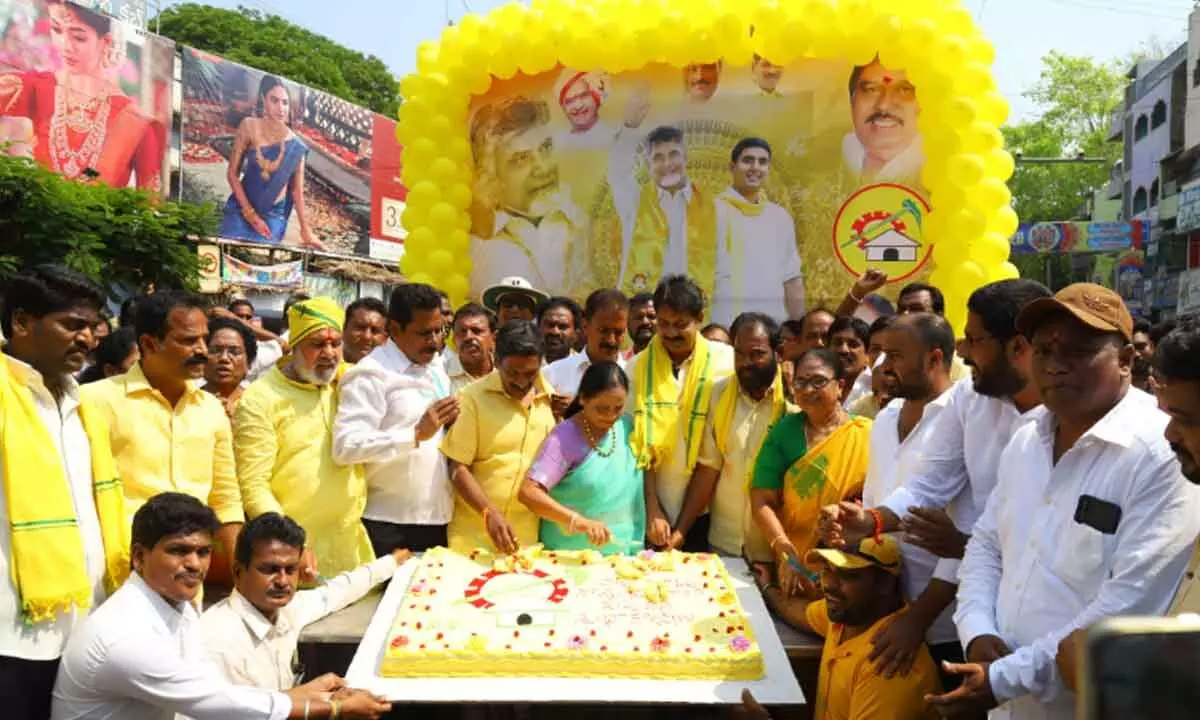 Former MLA Sugunamma and other tdp leaders cutting a cake at NTR Circle in Tirupati on Wednesday to celebrate party’s national president N Chandrababu Naidu’s birthday