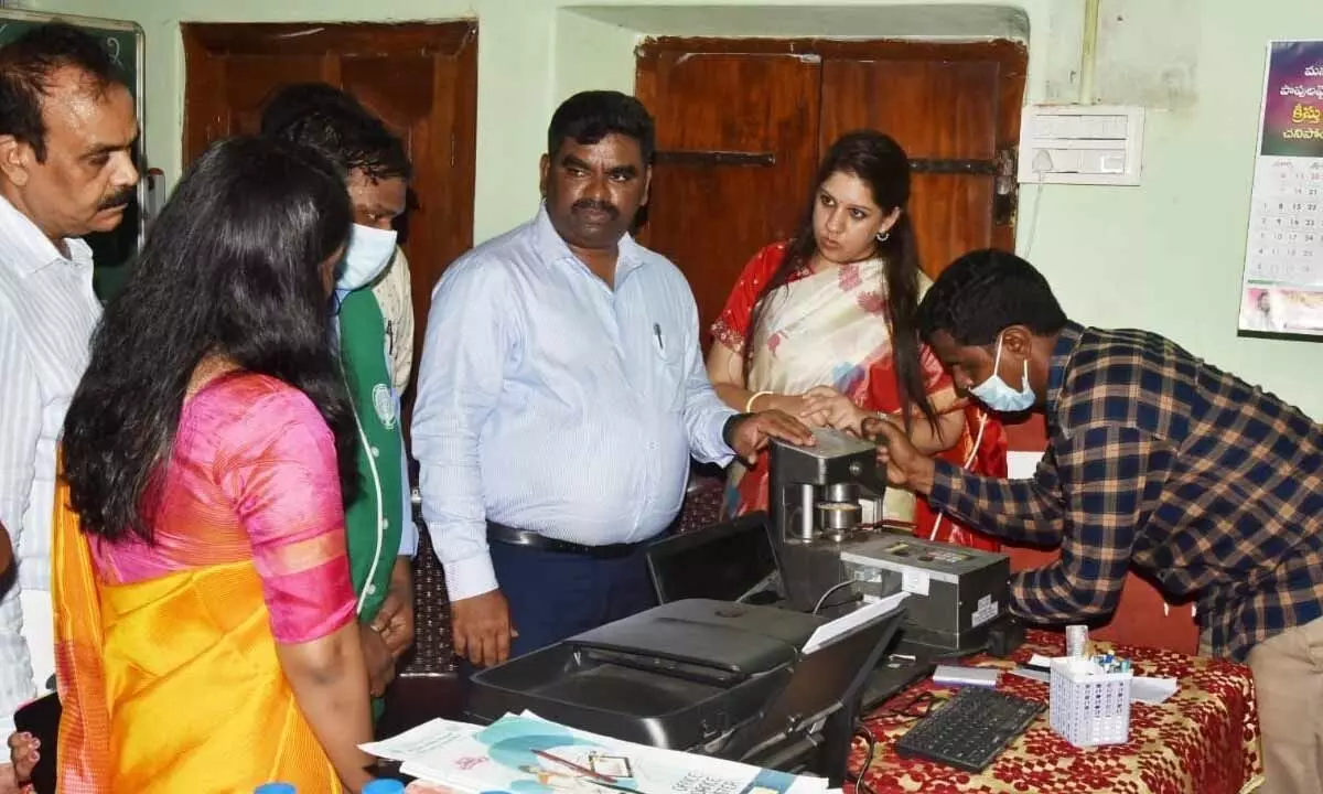 State Civil Supplies Corporation Vice-Chairman and Managing Director Veera Pandyan along with District Collector Kritika Shukla inspecting a paddy procurement center at Jalluru village on Thursday
