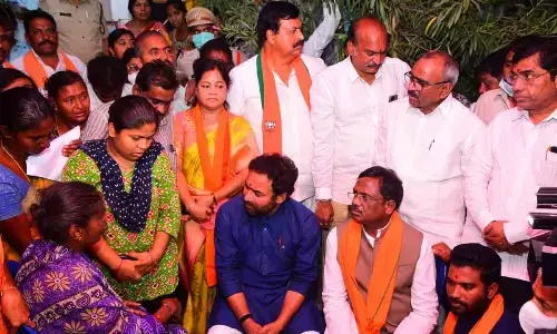 Union Minister G Kishan Reddy interacting with deceased BJP activist Sai Ganesh’s family members in Khammam on Friday