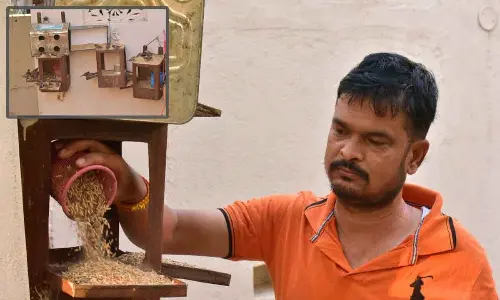 Bird lover Anantula Ramesh feeding birds at his house in Karimnagar