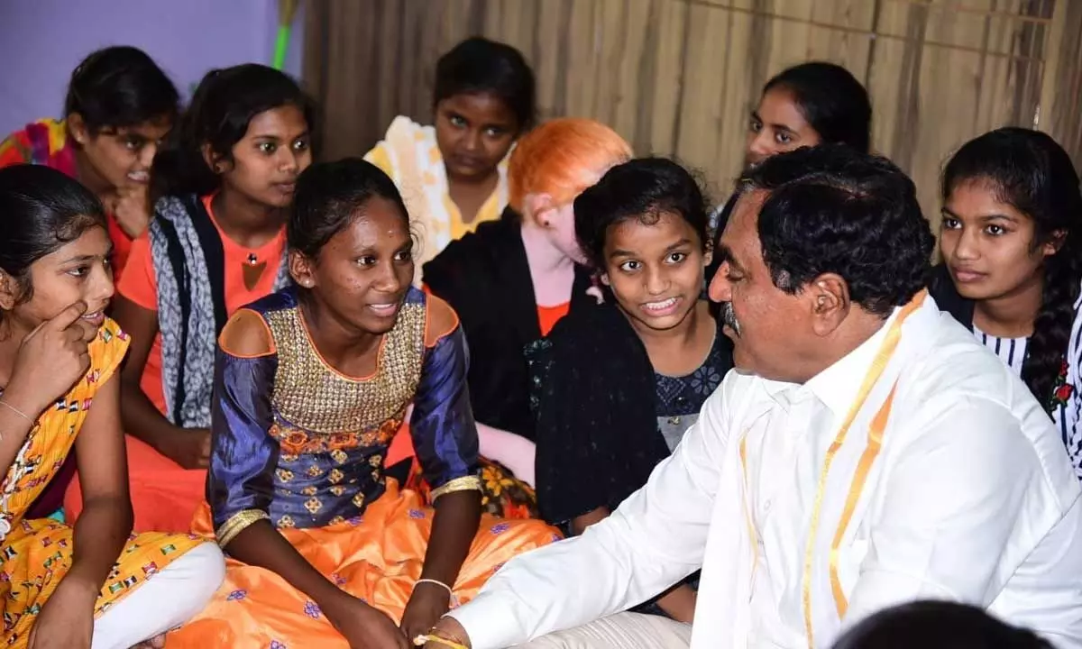 Minister for Panchayat Raj Errabelli Dayakar Rao interacting with the children at an orphanage in Thorrur in Mahabubabad district on Saturday