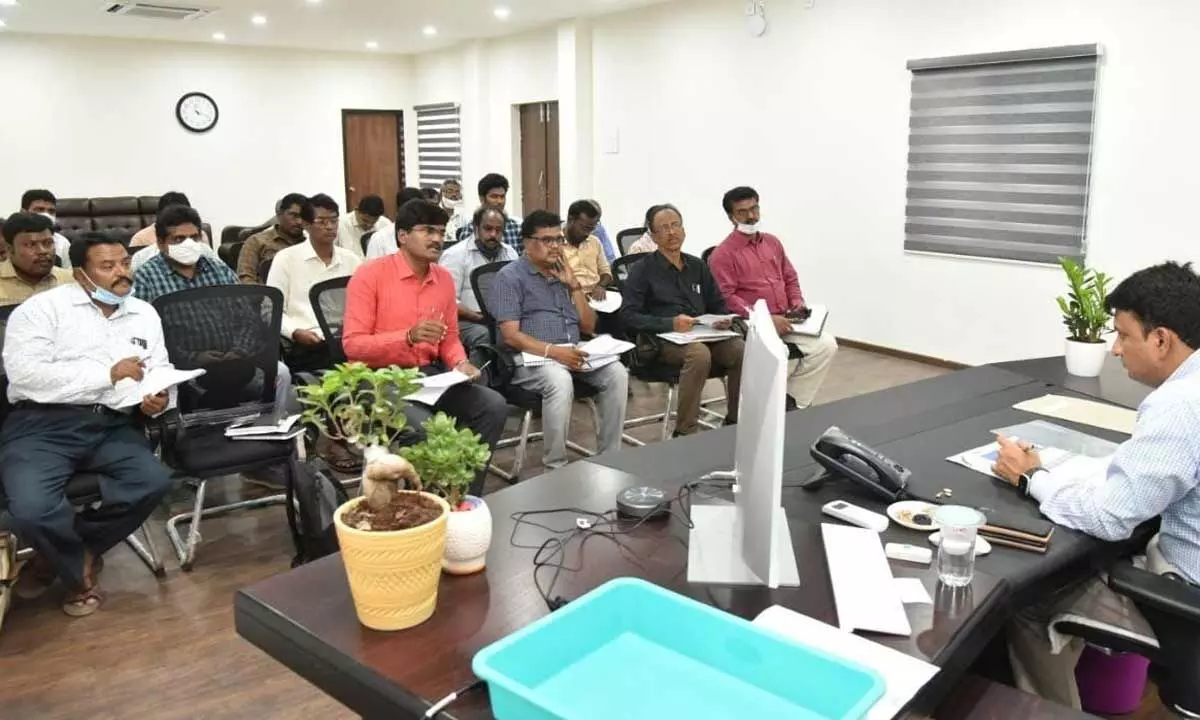 District Collector P S Girisha addressing a review meeting on Manabadi Nadu-Nedu in Rayachoti on Saturday.