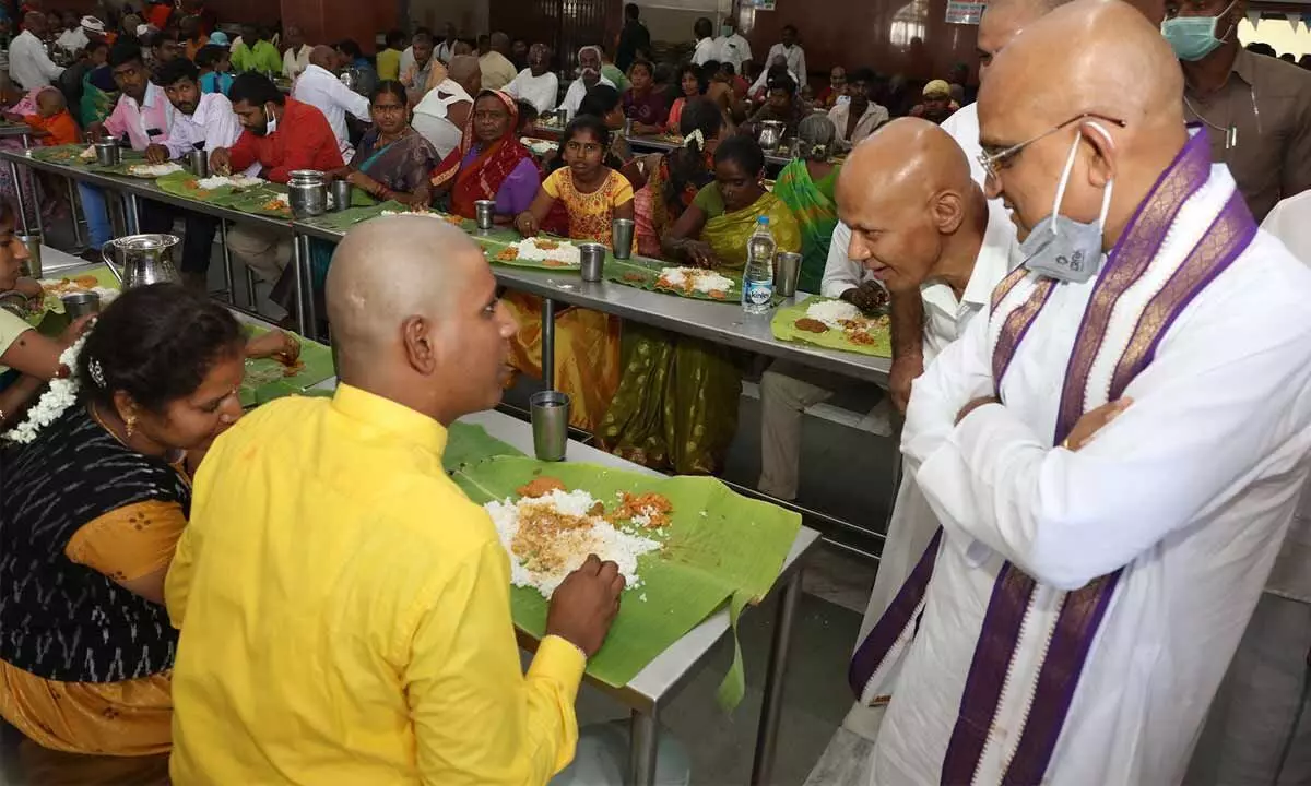 TTD  EO Dr K S Jawahar Reddy along with Additional EO A V Dharma Reddy and CVSO Narasimha Kishore interacting with a devotee at Anna Prasadam complex in Tirumala on Saturday.