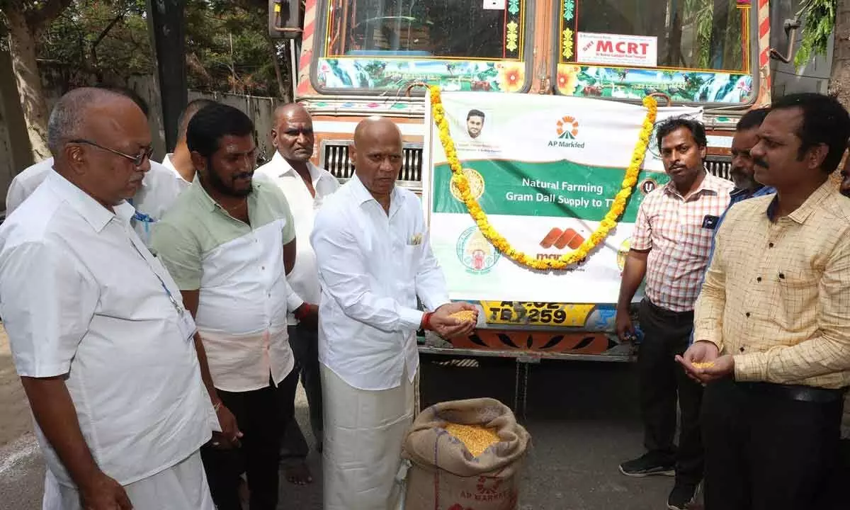 TTD Additional EO A V Dharma Reddy receiving the stock of organic pulses procured by Markfed from farmers for TTD, at Marketing Godown in Tirupati on Saturday