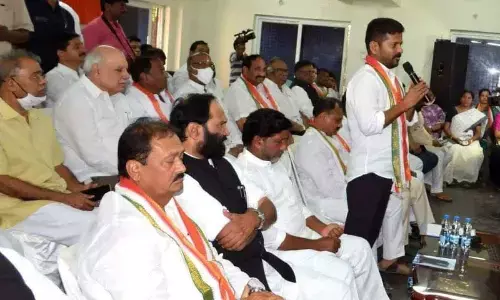 TPCC chief A Revanth Reddy addressing a meeting at Gandhi Bhavan in Hyderabad on Saturday