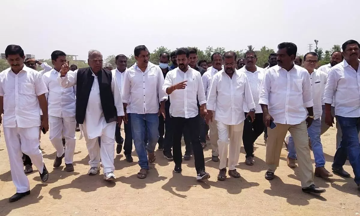 TPCC chief A Revanth Reddy along with Congress senior leaders inspecting the Helipad location at St. Gabriel Arts and Science College grounds in Hanumakonda on Monday. Photo: G Shyam Kumar
