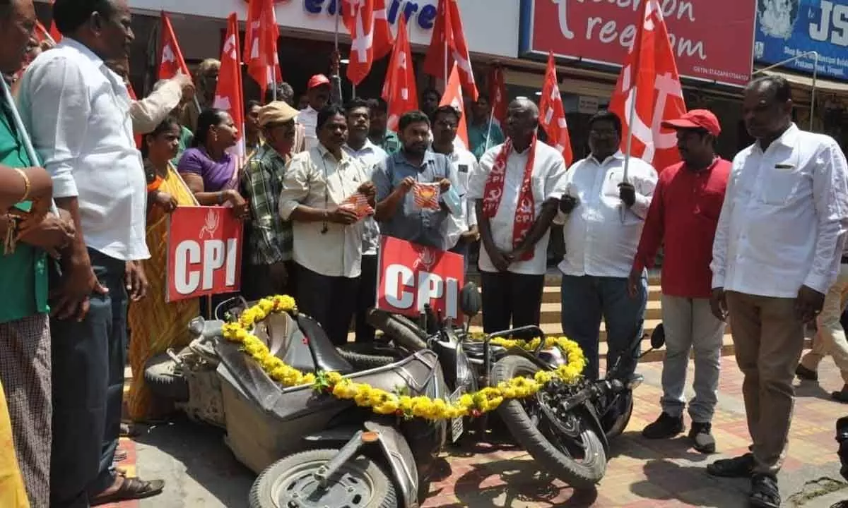 CPI activists conducting a mock funeral to a scooter protesting hike in fuel prices, in Tirupati on Monday.