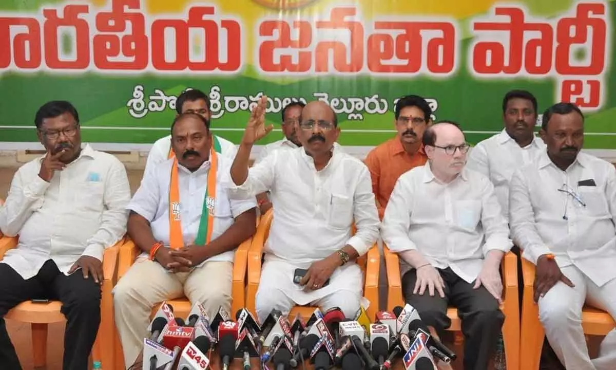 BJP MLC Vakati Narayana Reddy addressing the media in Nellore on Monday. Party leaders K Anjaneya Reddy and G Bharat Kumar  are also seen.