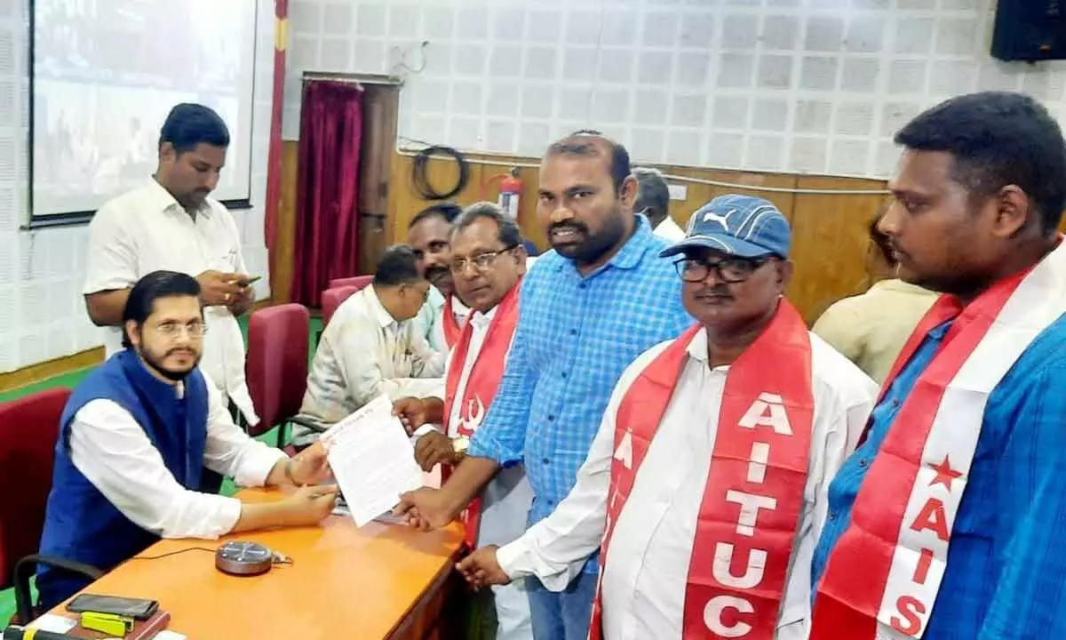 AIYF state vice-president Nagaramudu and AISF district president Dhanunjayudu submitting a representation to Collector Dr Manazir Jilani Samoon in Nandyal on Monday.