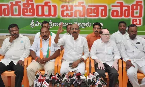BJP MLC Vakati Narayana Reddy addressing the media in Nellore on Monday. Party leaders K Anjaneya Reddy and G Bharat Kumar  are also seen.