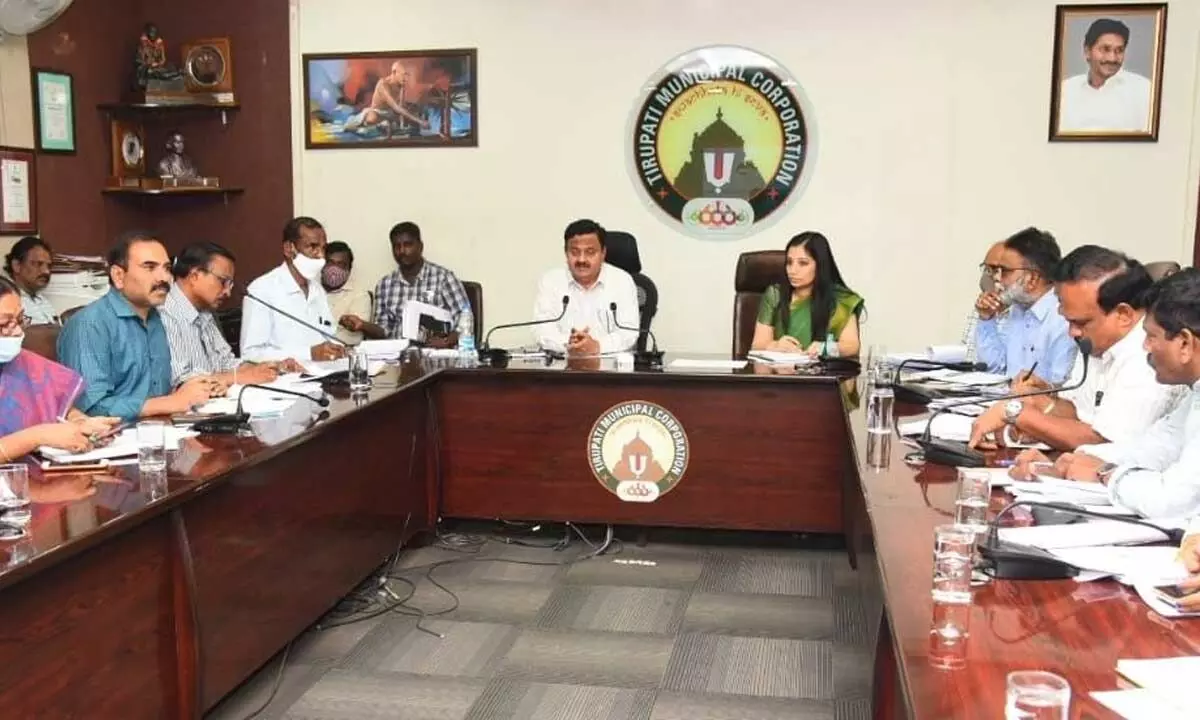 District Collector K Venkataramana Reddy along with Municipal Commissioner Anupama Anjali reviewing the housing programme in Jagananna Colonies at the municipal office in Tirupati on Tuesday