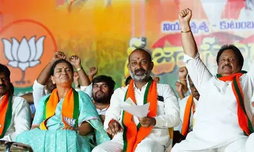 BJP national vice president DK Aruna, State BJP president Bandi Sanjay Kumar and former MP Jitender Reddy at a press meet in Gadwal on Tuesday