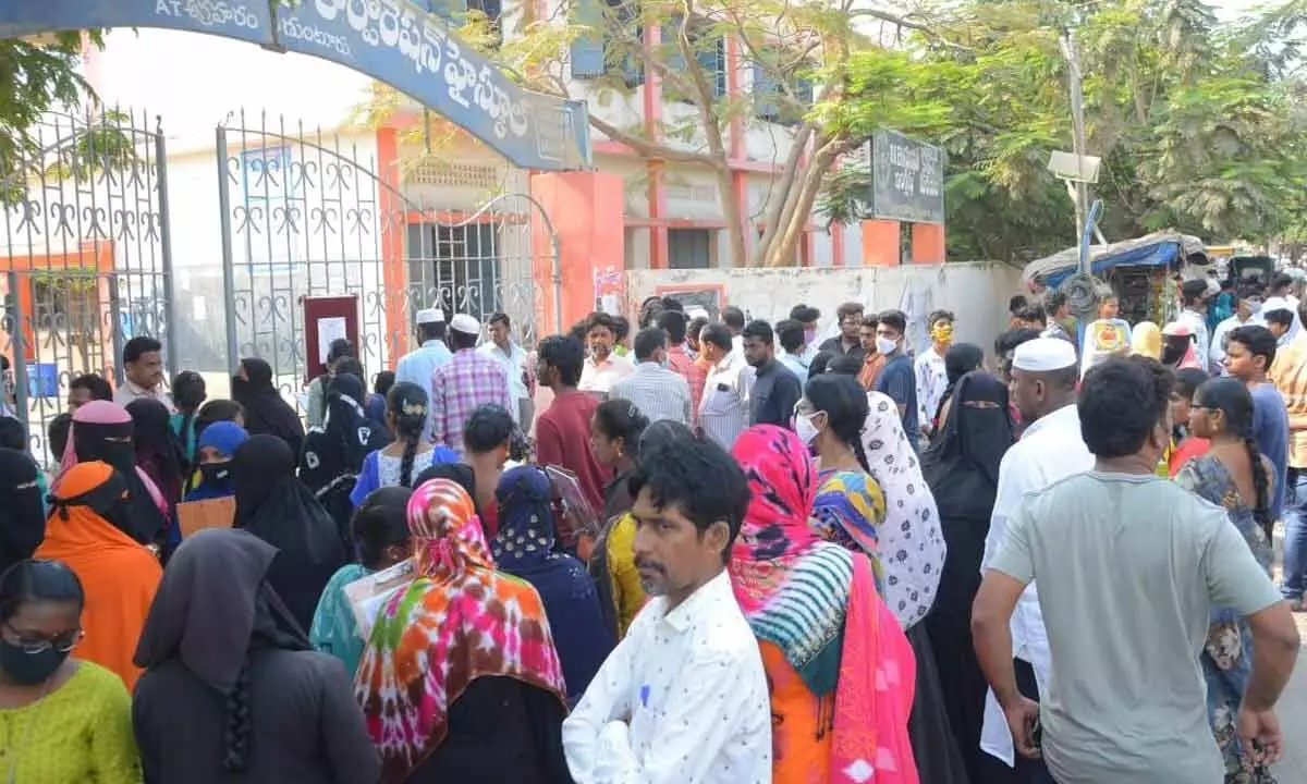 SSC students along with their parents waiting at SKBM GMC High School in Guntur on Wednesday