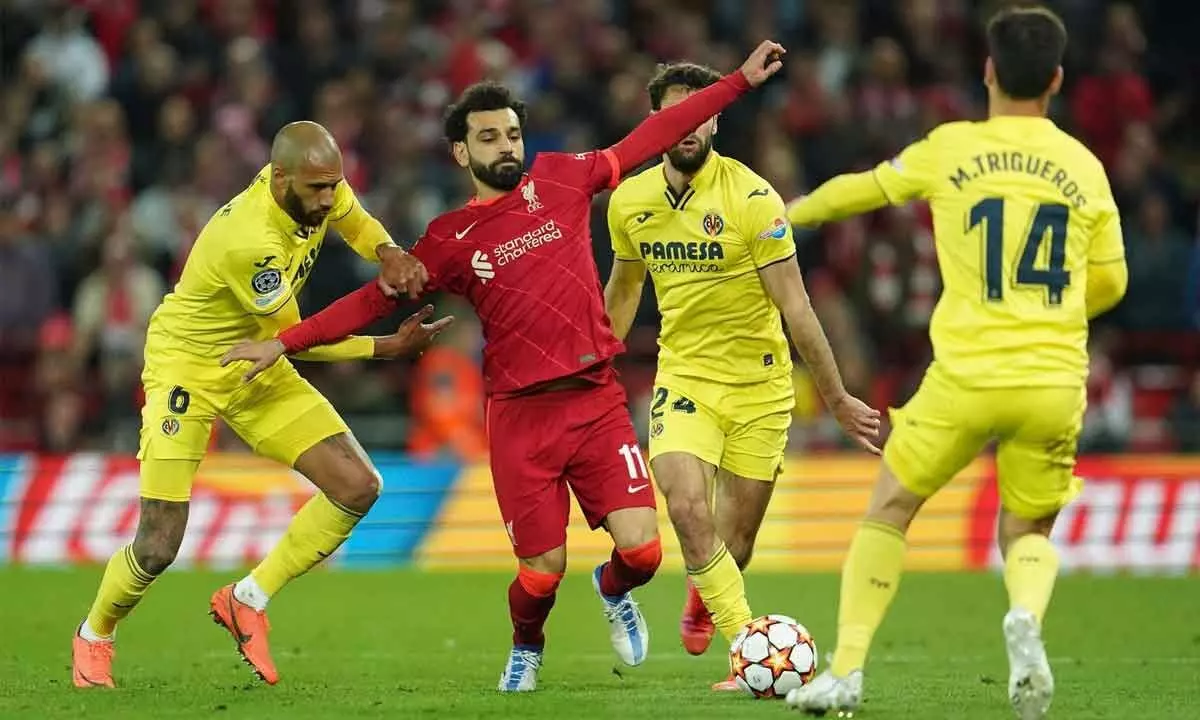 Liverpools Mohamed Salah (second left) fights for the ball with Villarreals Etienne Capoue, (left) Alfonso Pedraza (second right) and Manu Trigueros during the Champions League semi final, first leg match at Anfield stadium in Liverpool, England on Wednesday
