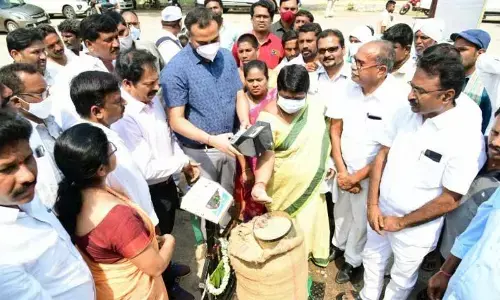 ZP Chairperson K Vijaya and Dollector RV Karnan inaugurating a paddy procurement centre at Jammikunta Market Yard in Karimnagar district on Tuesday