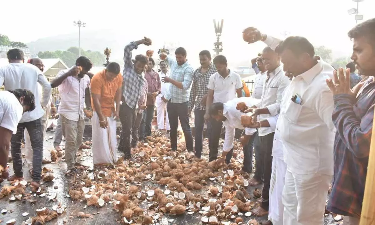 Tirumala locals breaking coconuts at Akhilandam as a thanksgiving gesture to Lord Venkateswara after the TTD Trust Board resolved their three long pending issues on Saturday