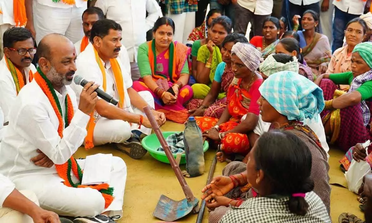 State BJP president Bandi Sanjay Kumar speaking to MGNREGS workers in Narayanpet district on Monday