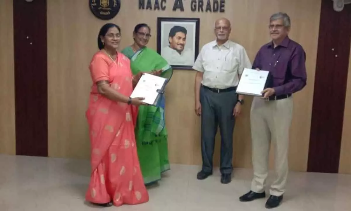 Registrars of SPMVV and IISER-T Prof D M Mamatha and Dr Mohan Kumar exchanging the copies of MoU in the presence of V-C Prof D Jamuna and IISER Director Prof K N Ganesh in Tirupati on Monday.