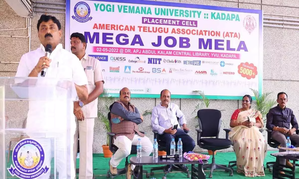 Kamalapuram MLA P Ravindranath Reddy addressing unemployed youth in the mega job mela organised jointly by ATA and YVU placement cell in Kadapa on Monday.