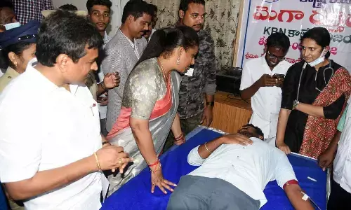 Minister Roja speaking to students donating blood at the mega camp in Vijayawada