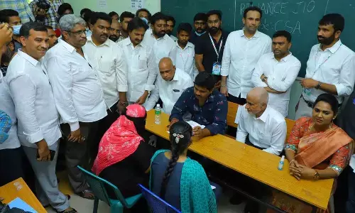 Rajya Sabha member V Vijayasai Reddy, MLC Lella Appi Reddy, MLA Dr Undavalli Sridevi participating in the selection of candidates at the YSRCP Mega Job Mela on ANU premises on Saturday