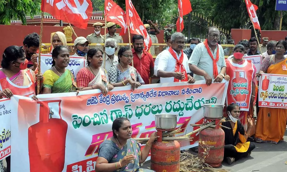 CPM leaders and women activists staging a protest in front of Vijayawada Collectorate  on Monday