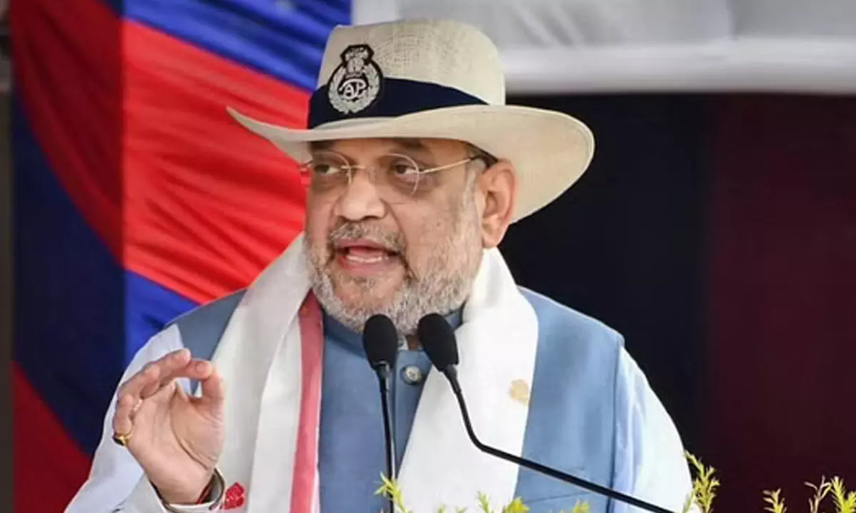 Union Home Minister Amit Shah addresses a special programme for the presentation of the Presidents Colours to the Assam Police, in Guwahati. (Photo | PTI)