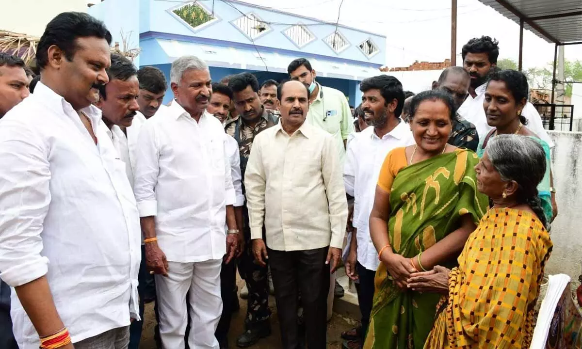 Forests and Mines Minister Peddireddi Ramachandra Reddy interacting with people on implementation of welfare schemes at Bodevandla Palli in Punganur constituency on Wednesday.