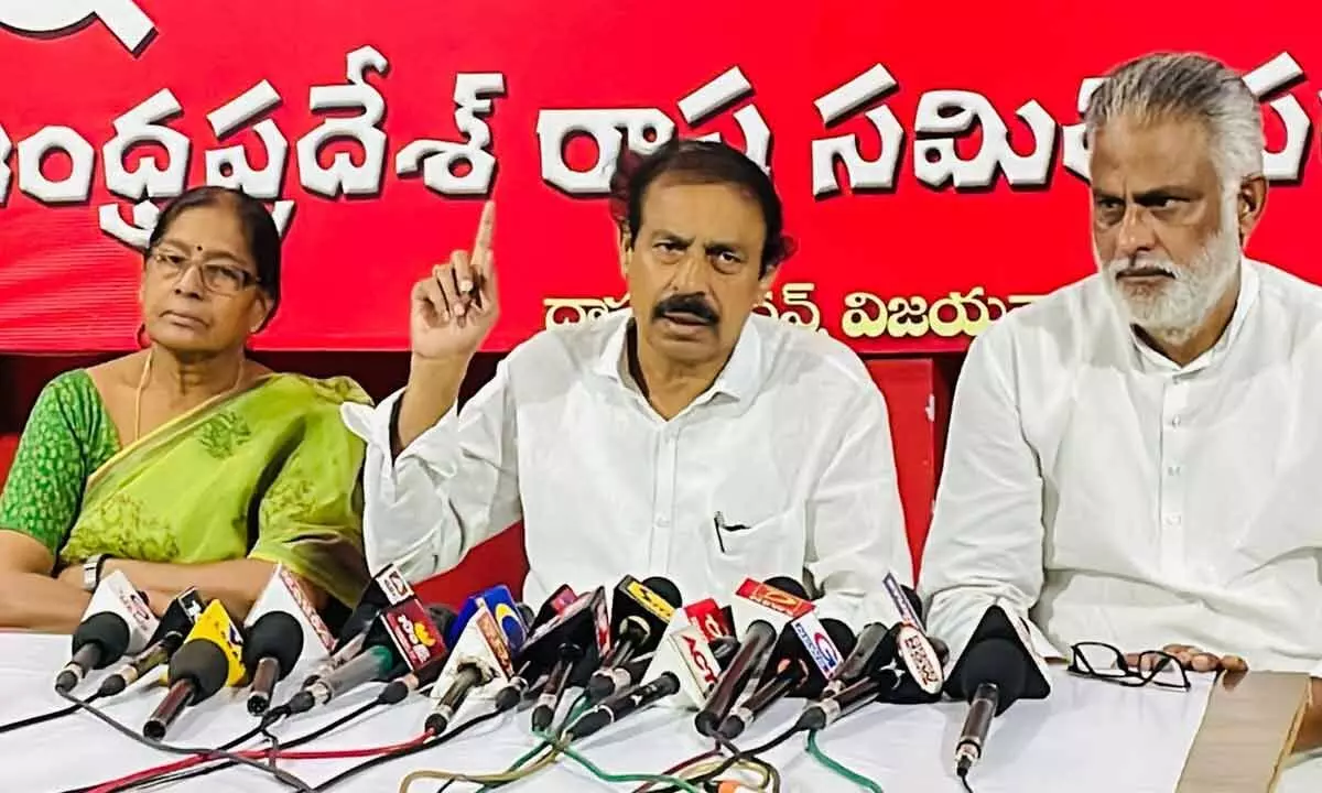 Flanked by Akkineni Vanaja and JV Satyanarayana Murthy, CPI State secretary K Ramakrishna addressing the media in Vijayawada on Wednesday