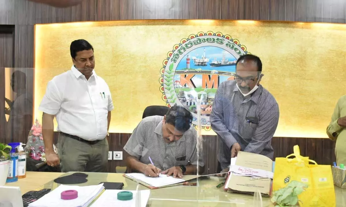 K Ramesh taking charge as KMC Commissioner at his chambers in Kakinada on Wednesday
