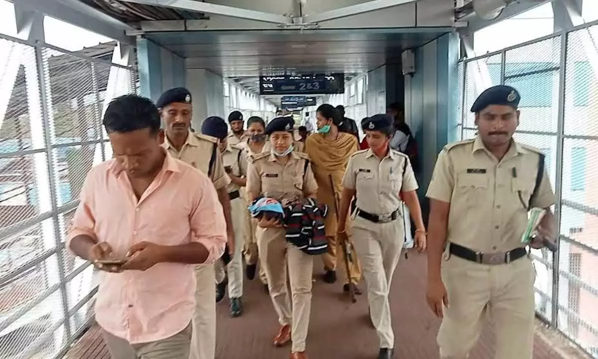 RPF personnel taking the new-born who was left abandoned in B1-coach to the Divisional Railway Hospital in Visakhapatnam on Wednesday