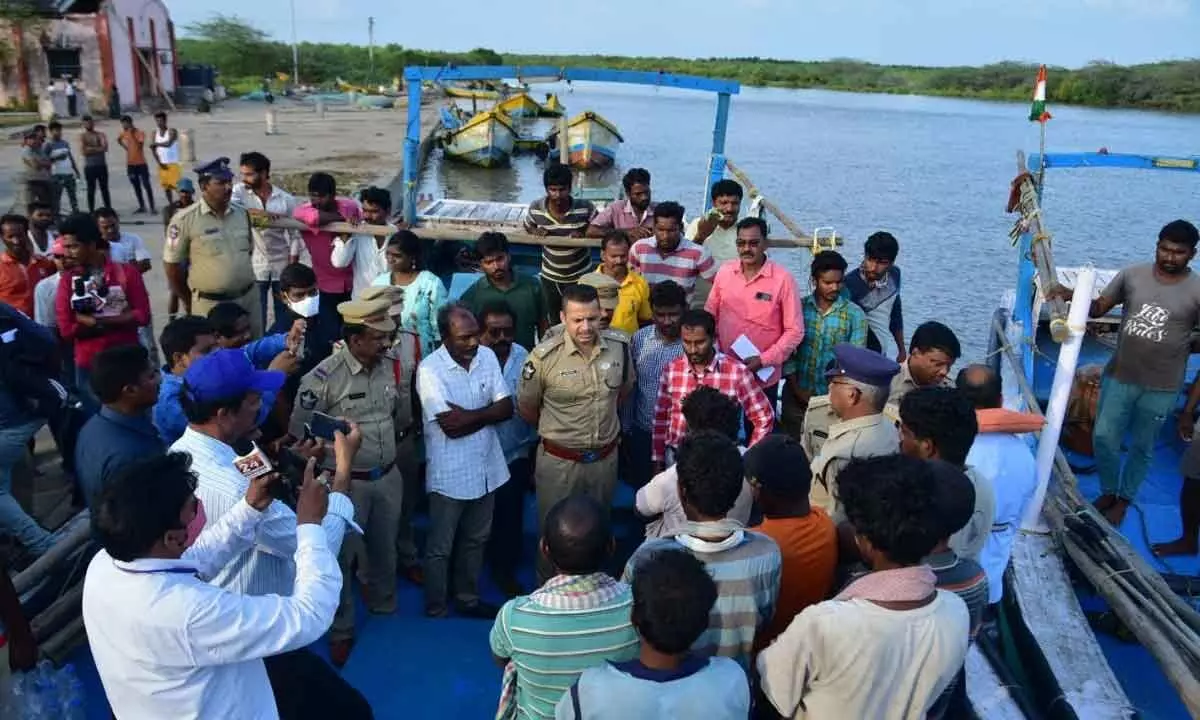 SP Siddharth Kaushal interacting with the rescued fishermen in Machilipatnam on Thursday