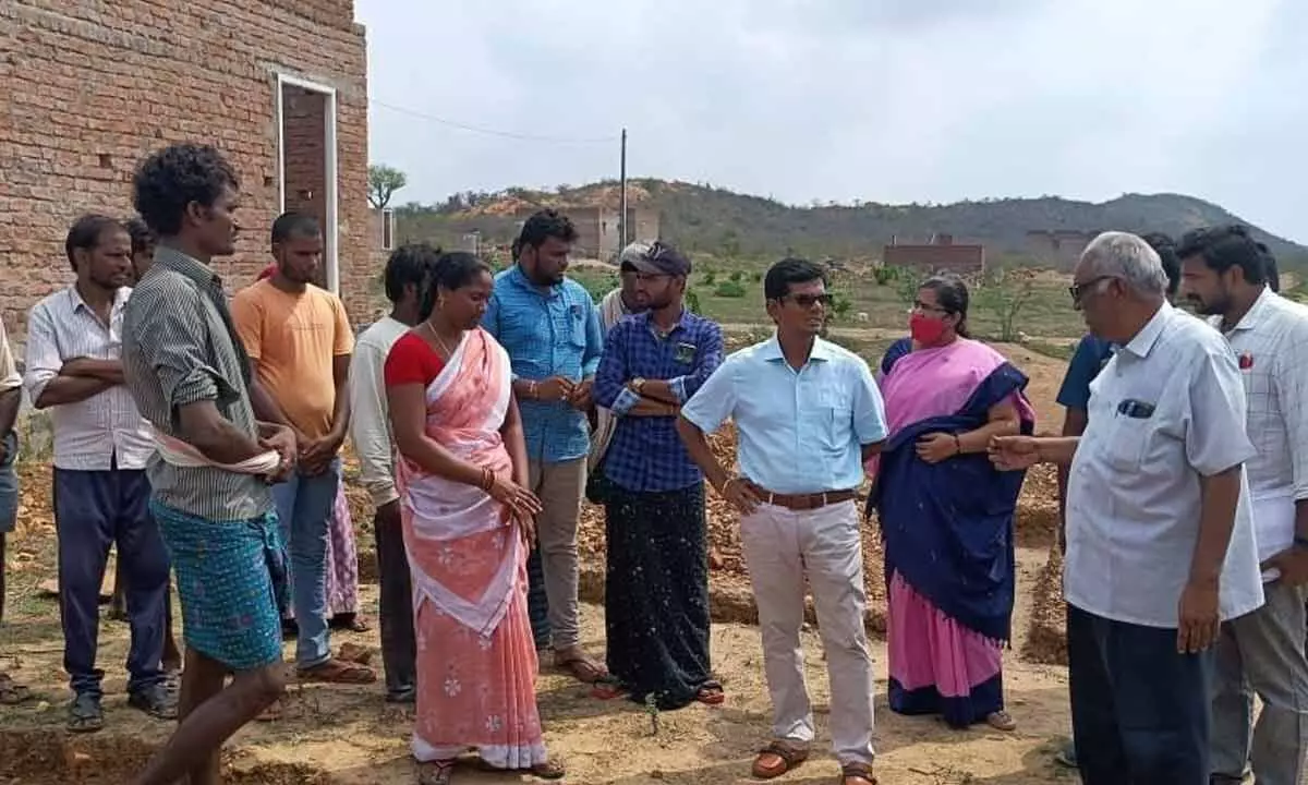 Prakasam Collector AS Dinesh Kumar interacting with housing beneficiaries at Mekalavaripalem on Saturday