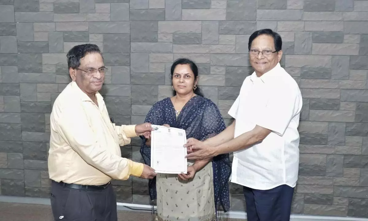 SRM University-AP Vice-Chancellor Prof VS Rao, Pro-Vice-Chancellor Prof D Narayana Rao and Dr Sheela Singh with the Patent Certificate on the innovative engine piston rings developed by Dr Sheela Singh, at SRM University-AP in Neerukonda on Tuesday