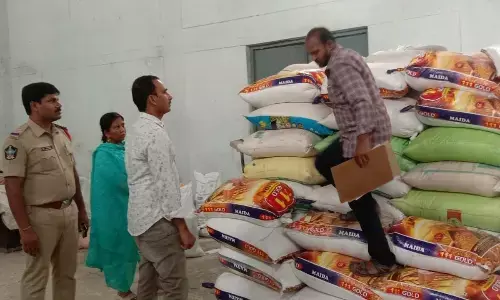 Circle Inspector of Vigilance and Enforcement department Nagaraj Yadav and his staff seizing the PDS rice at Banaganapalle in Nandyal district on Tuesday
