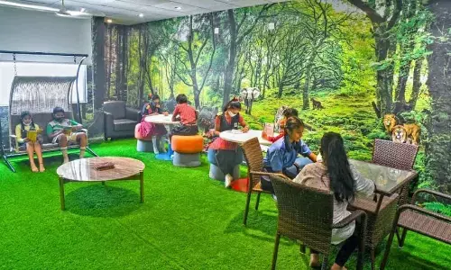 Children reading at ‘Miyawaki’ children section highlighting the forest theme at Visakhapatnam Public Library in Visakhapatnam