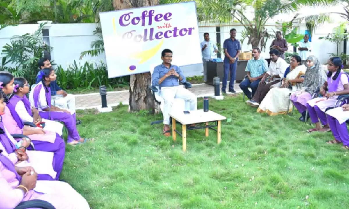 Collector Dinesh Kumar interacting with students from government schools as part of Coffee with Collector programme at his reesidence in Ongole on Saturday