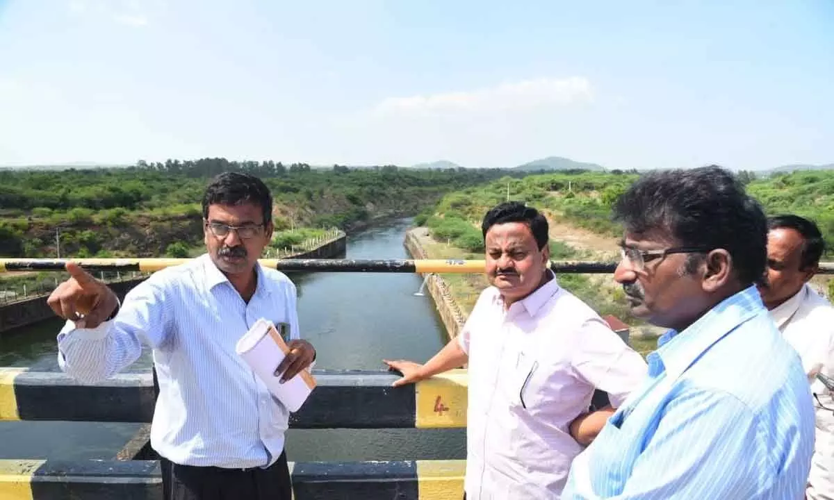 District Collector K Venkata Ramana Reddy along with irrigation officials inspecting the Telugu Ganga canal in Nellore on Saturday
