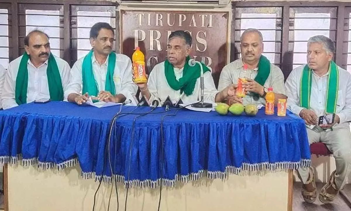 AIFFA leaders showing Coco Cola product Mazaa to media persons in Tirupati on Saturday.