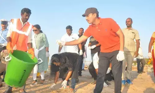 Bapatla district collector Vijaya Krishnan, SP Vakul Jindal along with officials and staff participating in Swachh Sankalp programme at  Suryalanka Beach on Saturday