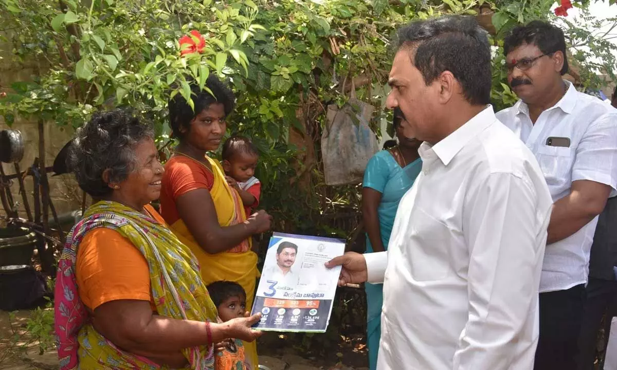 Agriculture minister Kakani Govardhan Reddy distributing pamphlet as part of Gadapa Gadapaku Prabhutvam in Viruvuru on Sunday
