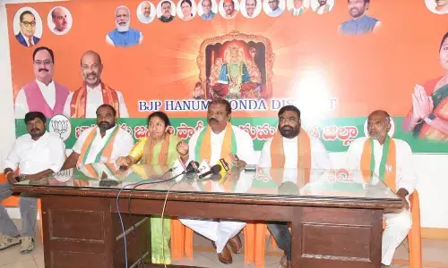 BJP State general secretary G Premender Reddy addressing a press conference in Hanumakonda on Sunday. Party Hanumakonda district president Rao Padma is also seen.