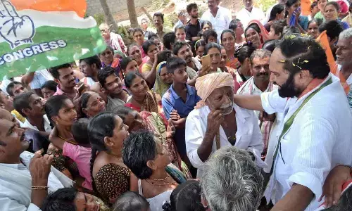 Senior Congress leader and MP Uttam Kumar Reddy interacting with villagers in Nalgonda on Monday